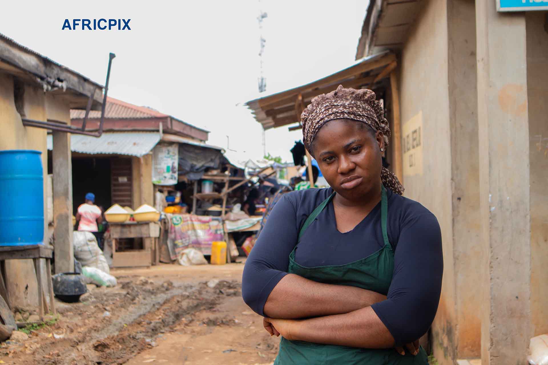 Empowered African Woman in Power Pose Outside Local Shop